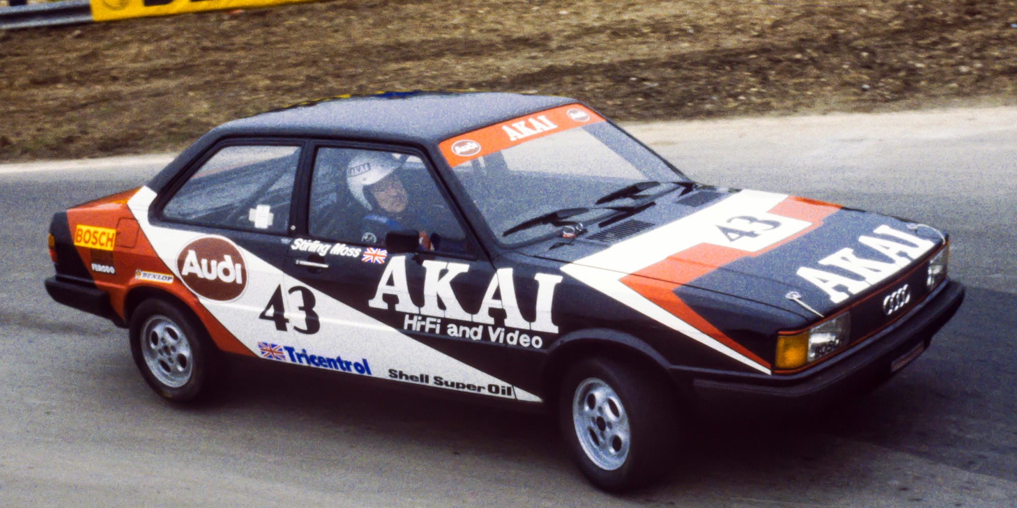 Stirling Moss cornering in the British Saloon Car Championship Audi 80