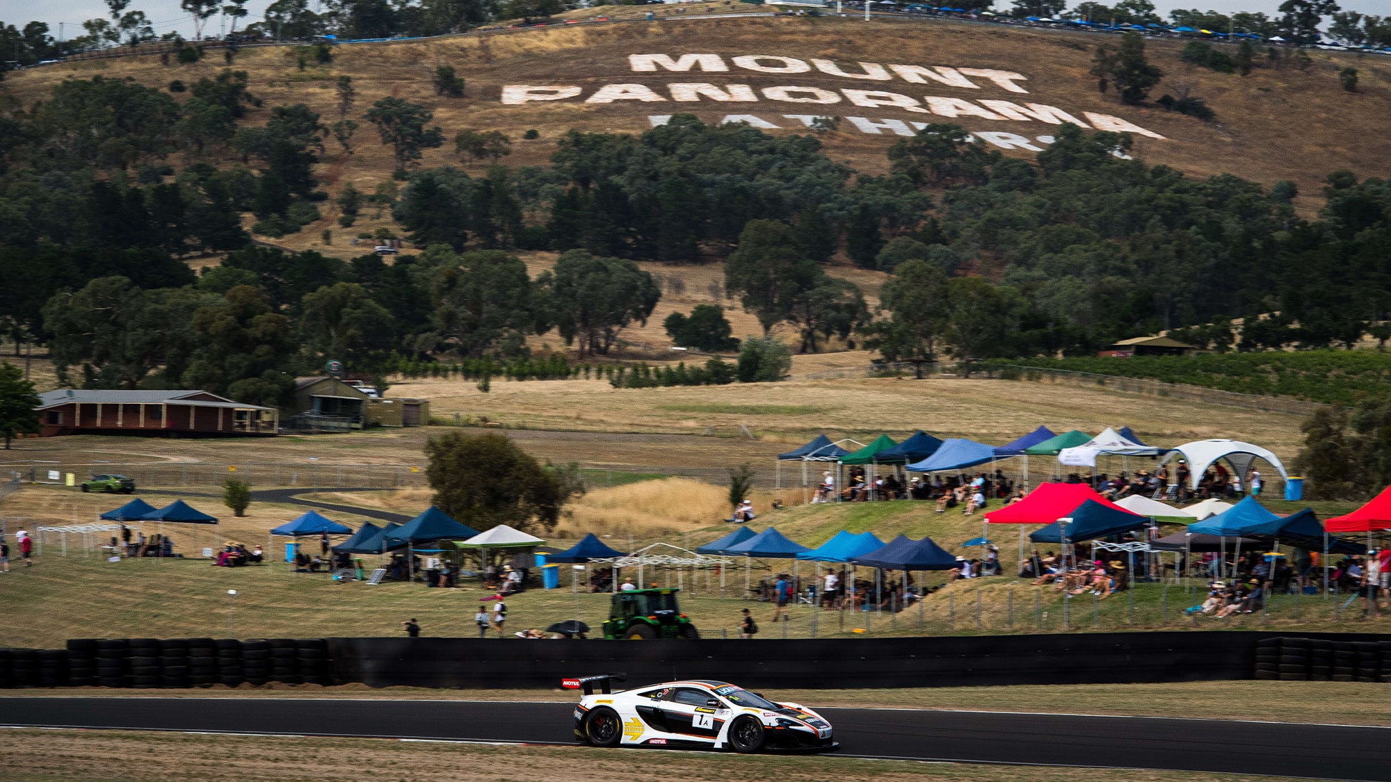 McLaren 650S GT3 in front of Mount Panorama sign