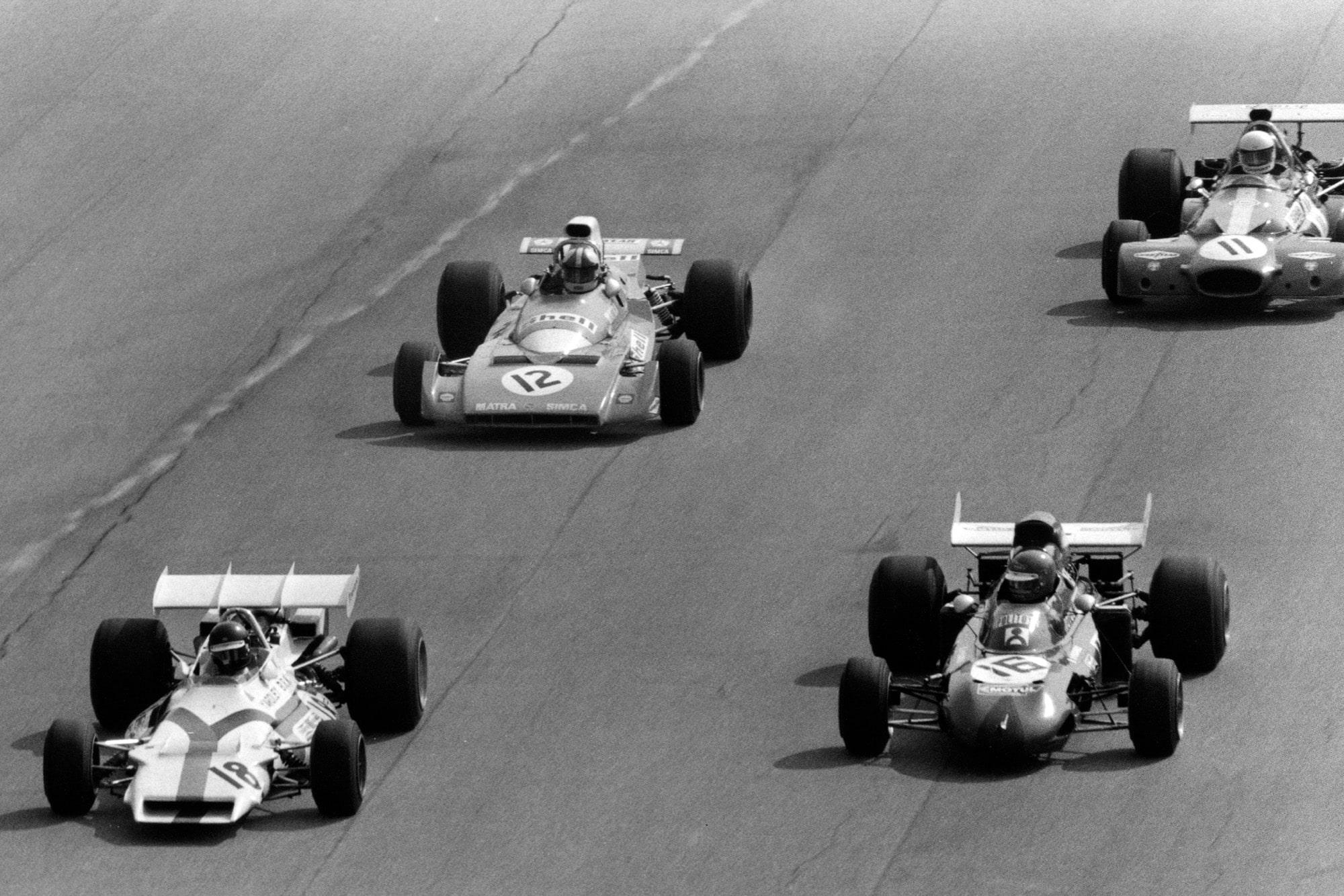 Peter Gethin Ronnie Peterson Chris Amon and Tim Schenken driving in a slipstreaming pack at the 1971 Italian Grand Prix