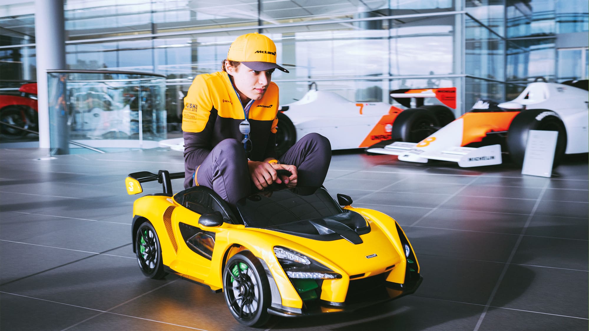 Lando Norris in the child's toy version of the McLaren Senna