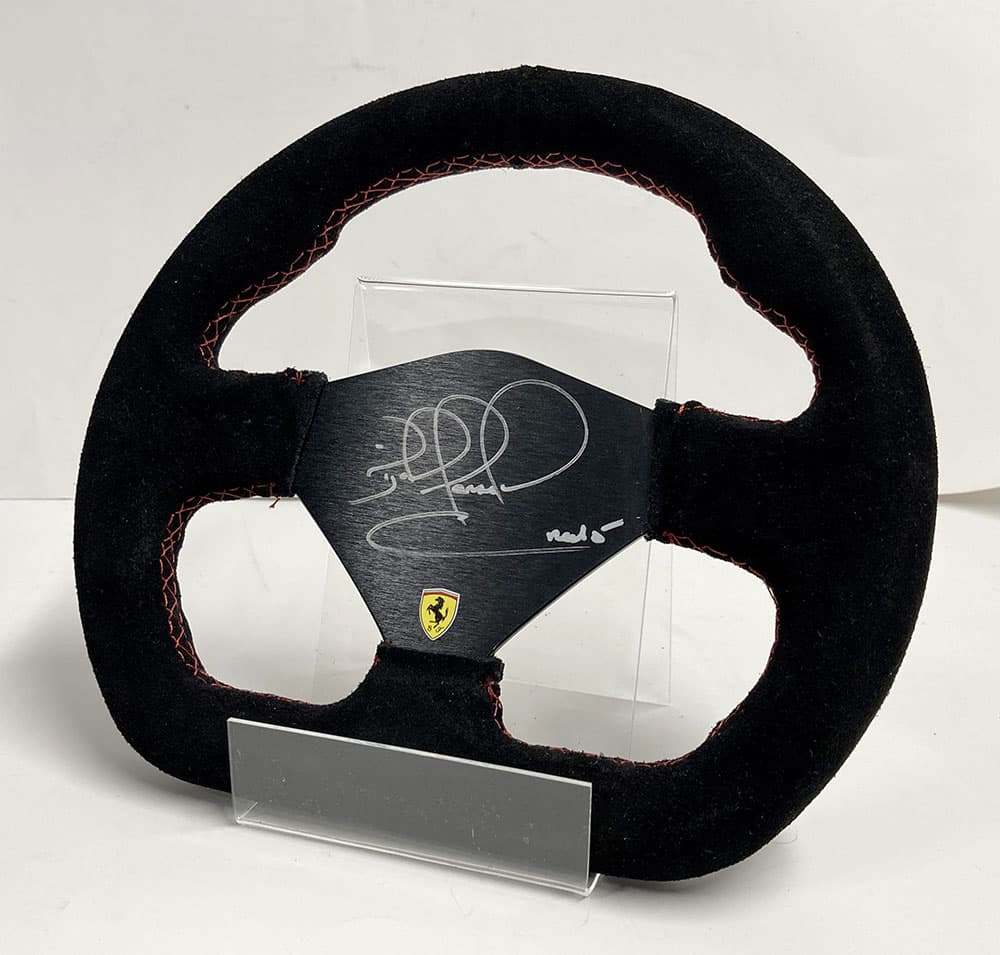 Ferrari steering wheel | Nigel Mansell signed