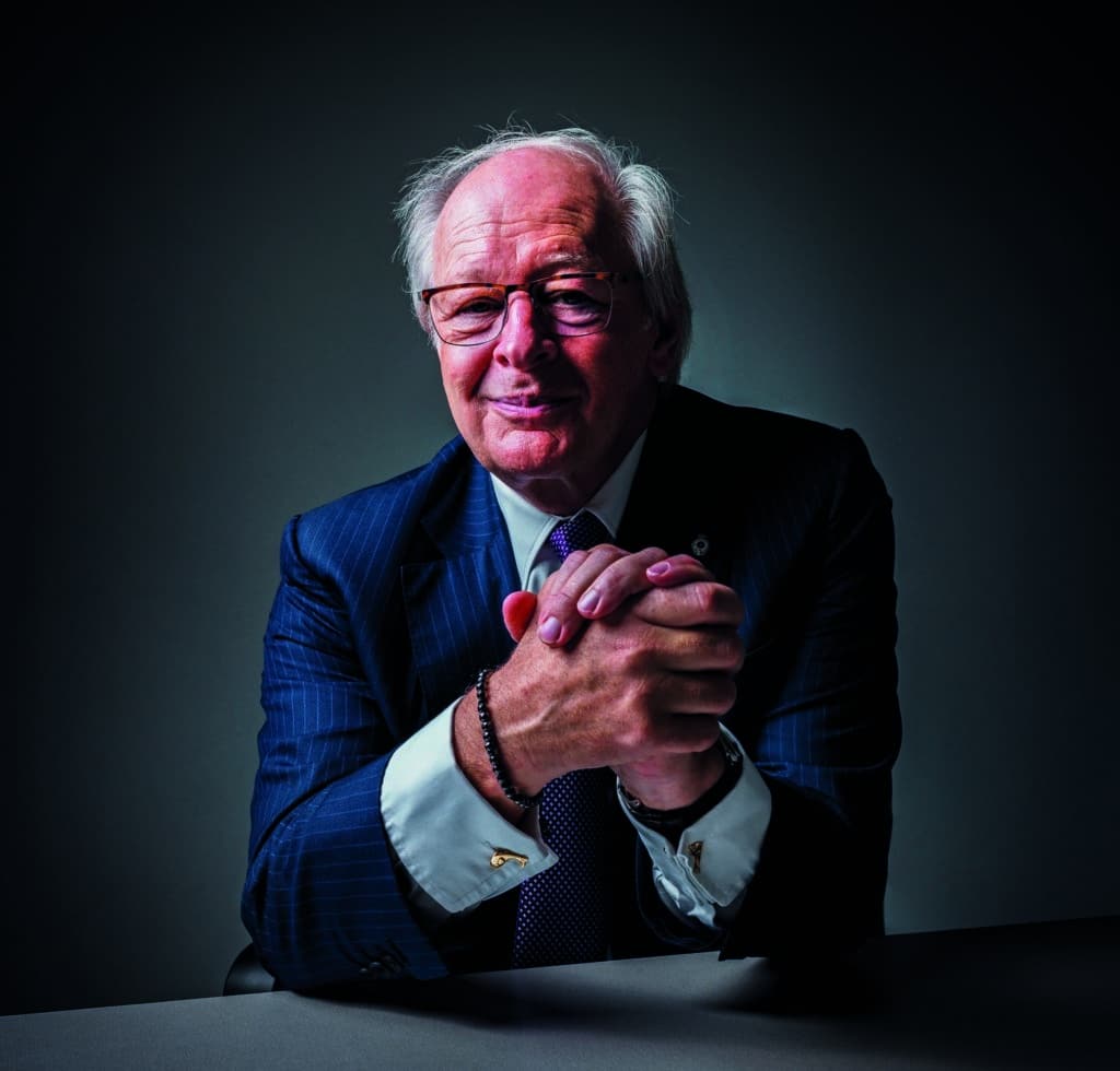 Graham Stoker leaning on table portrait