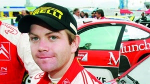 Conrad Rautenbach (R) of Zimbabwe, driver of Citroen C4, smiles near his teammate and co-driver David Senior of Britain during the special stage on the second day of the Rally of Italy in Sardinia May 17, 2008.  REUTERS/Alessandro Bianchi (ITALY)