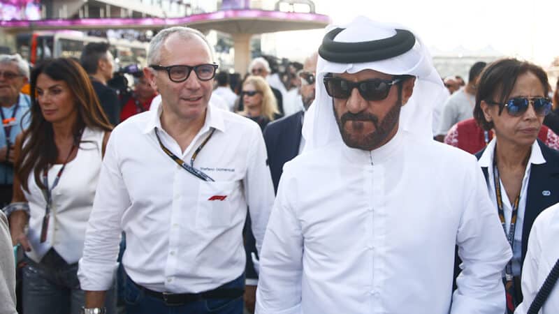 Stefano Domenicali and Mihammed ben Sulayem on 2023 Abu Dhabi GP grid