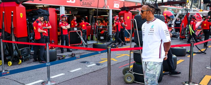 Lewis Hamilton looks in at the Ferrari garage at the Monaco Grand Prix