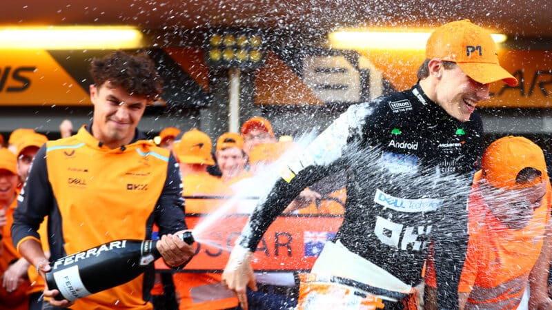 Lando Norris sprays Oscar Piastri with champagne after 2024 F1 Azerbaijan Grand Prix